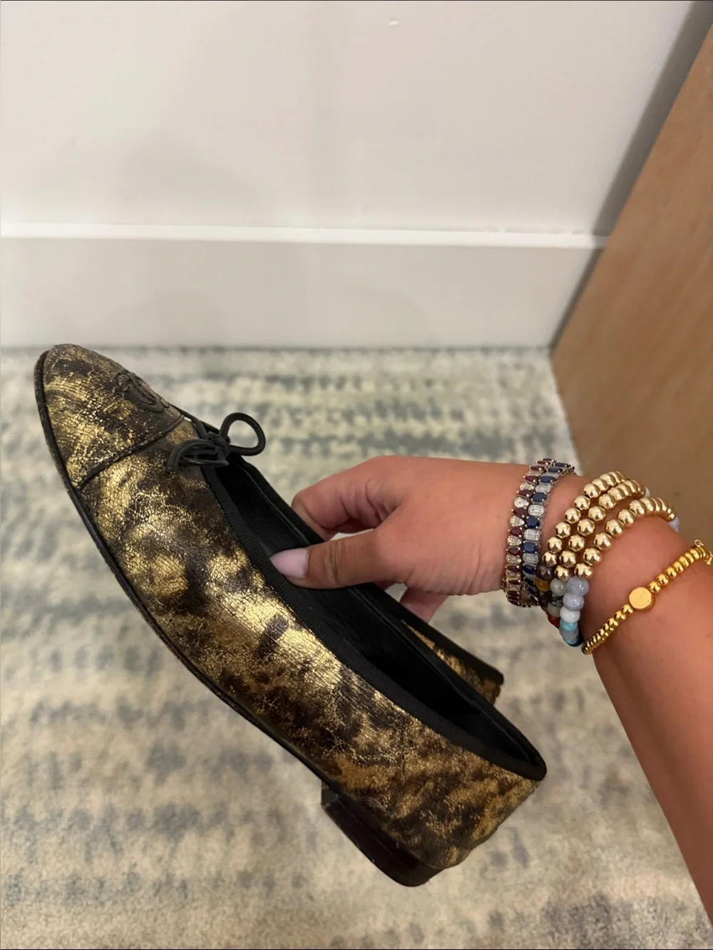 CHANEL Black and Gold Metallic Leather Ballet Flats
